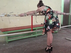 Lenna Ross is chained and she has a ball gag in her mouth