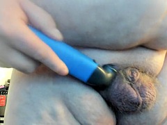 Molly shaves her genitals while sucking a dildo