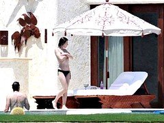 Milla Jovovich in the Pool with her Husband - Slideshow