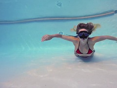 Blonde babe Sophie Murena masturbates in the pool