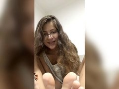 steamy woman show her feet soles and toes munch