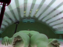 Dark haired girl in solarium