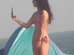 Hispanic fitness girl on the beach voyeur clip