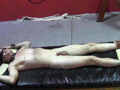 Jaden is tied up to the bed and teased by a dominant lad