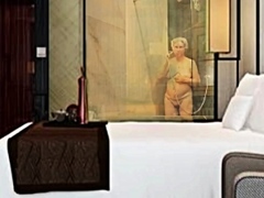 My grandmother is taking a bath at the hotel.