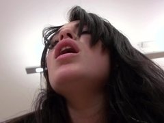 A raven haired babe with a nice cunt is sucking a big hard erection