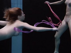 Andrejka and furthermore Aneta swim nude in the swimming pool
