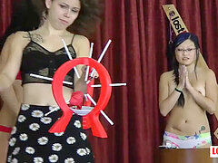trio innocent teenagers have fun a strip game of don't pop the balloon