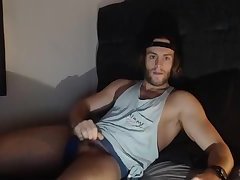 Surfer jerks his big uncut cock