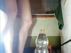 A huge two-liter bottle in the tender and sweet ass of a young guy who is playing with himself alone in the bath(PART 2)