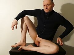 Kudoslong posing on a table in a jacket his flaccid penis is shaved smooth and starts masturbating and is soon erect