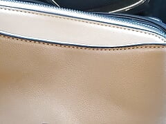 playing with customer NINE WEST purse while at my auto shop
