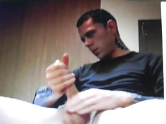 Hung tattoed guy jerks thick cock on cam