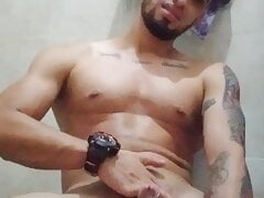 sexy latino touches his hard cock in the bathroom at home