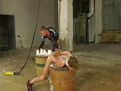 Bound BDSM twink has candle wax poured all over him