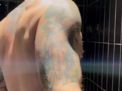 tattooed muscle stud Troy Daniels wanking off in the douche