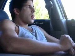 Big-cock jock strokes in his car