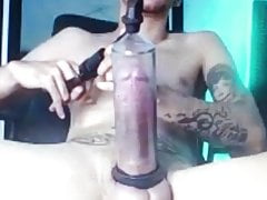 Latino vac tube pumping his huge thick cock in the tube