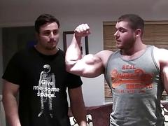 Hunks arm wrestle and show of their muscles