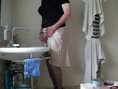 Demurely clad crossdresser stroking and spunking