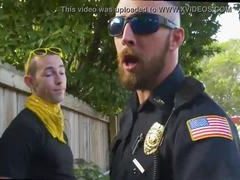 Two gay daddies dominate in muscle police-themed adult film