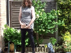 Sexy masturbating crossdresser in thigh boots outdoors 9