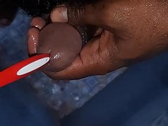 Desi inserting tooth brush in cock