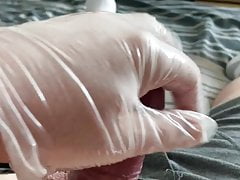 Creamy hand job with latex glove on