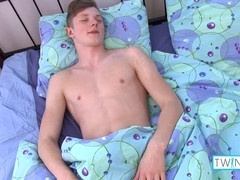 handsome gay Angel pleasures himself on the couch in the morning