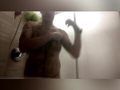 Boy up takes a shower and then