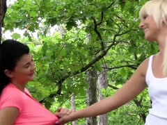 Katy Rose and Lucy Li are having lesbian sex in the woods