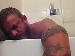 Bodybuilder flex in the shower