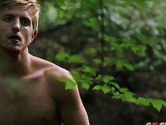 Handsome blonde moans as he's penetrated outdoors
