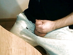 Guy is jerking off and cumming at the desk