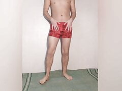 Hot guy tries on red boxers and poses sexy in them