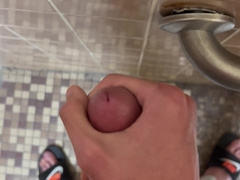 SlimSean spunking in a public shower