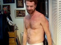 Hairy artist performs a striptease and masturbates with fur just for you