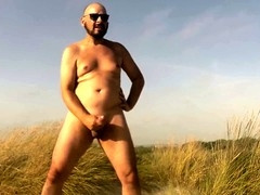 Epic beach handjob with a massive cumshot at the finale