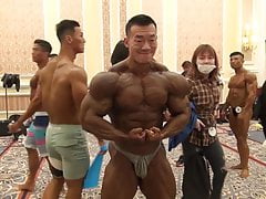 roided asian bodybuilder backstage