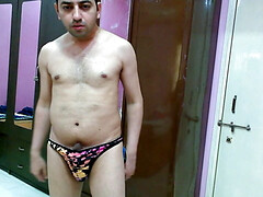 Hot nude boy trying out his new animal printed sexy thong.
