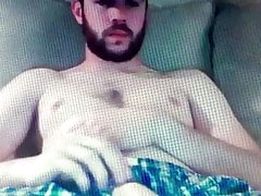 Bearded guy shows his huge hung flaccid cock in shorts