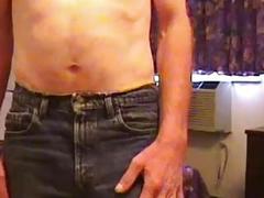 Mature gay slut with long hair and a mustache is going down on a boner