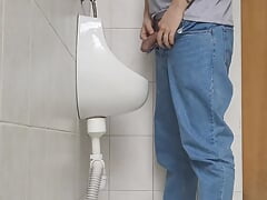 Risky jerk in public urinal at work