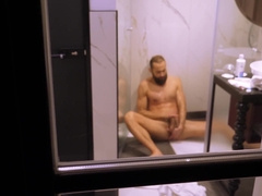 Mature boy filmed from outside while taking a bathroom and wanking off his rock hard wood