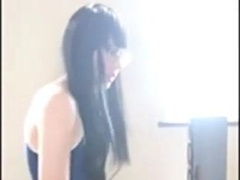 Cute Asian crossdresser cums on rubber cock