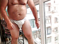 flashing off by the window smoking