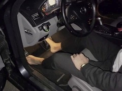 Young businessman getting off while cranking his Mercedes