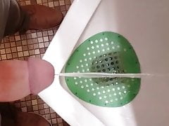 Taking a piss at urinal
