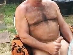Beefy muscle bear jerking his cock with big load