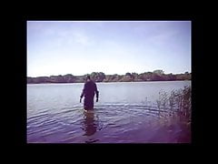 Swimming with PVC suit in the lake